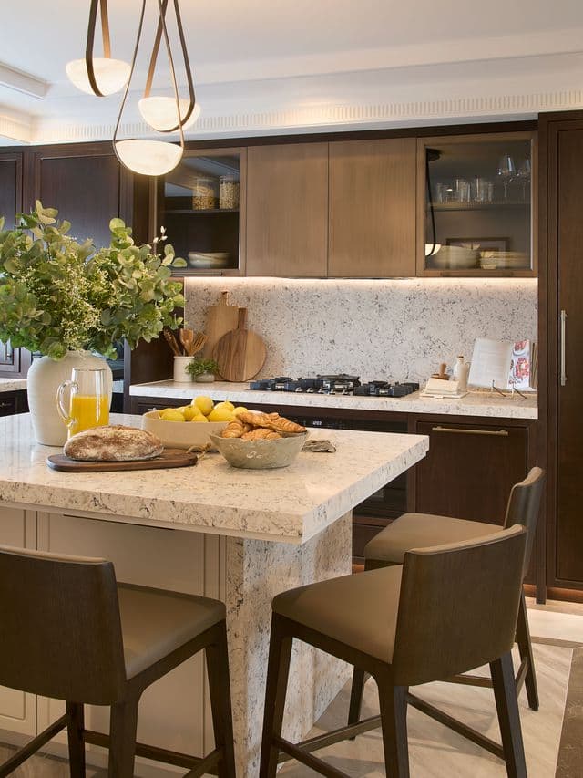 Rich dark timber kitchen with stone-topped island