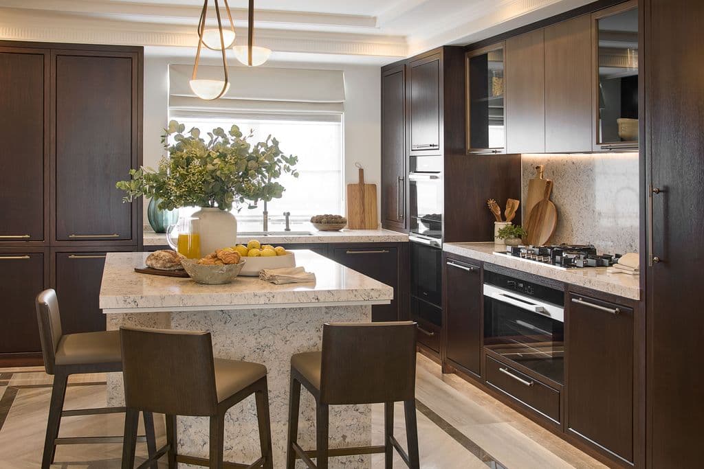 Dark wood luxury kitchen with warm pendant lighting