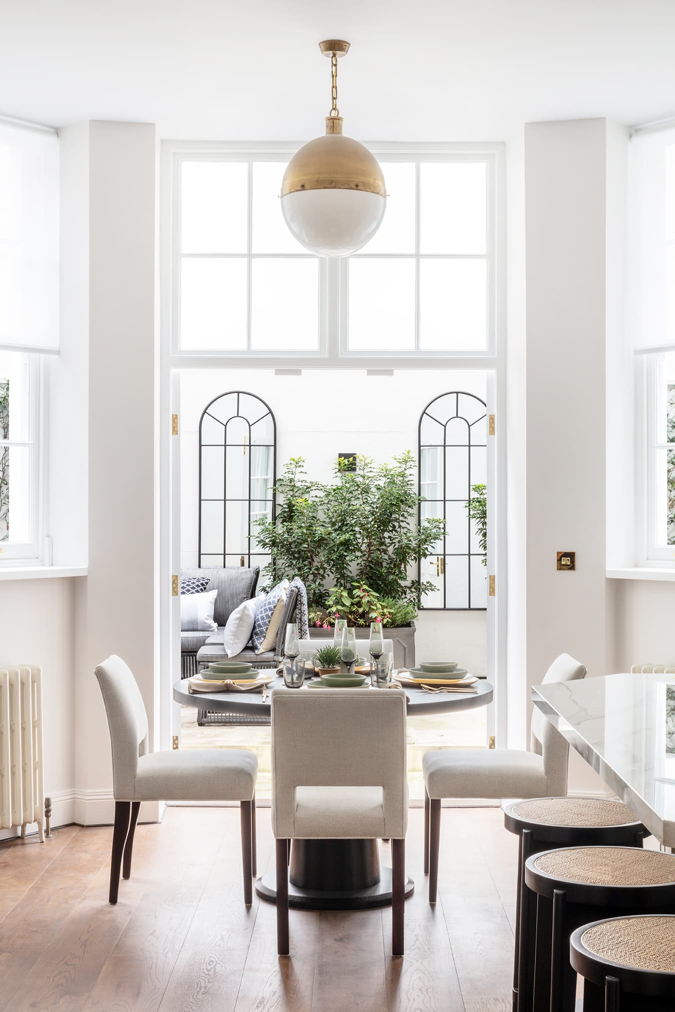 Elegant dining space with garden conservatory view